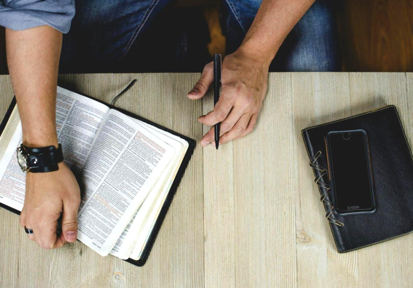 Marketing strategy session with team collaborating over documents and digital devices